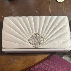 Giani Bernini champagne cream Clutch with Silver Emblem